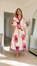 Front view of cream floral belted maxi dress with V-neck and kimono sleeves