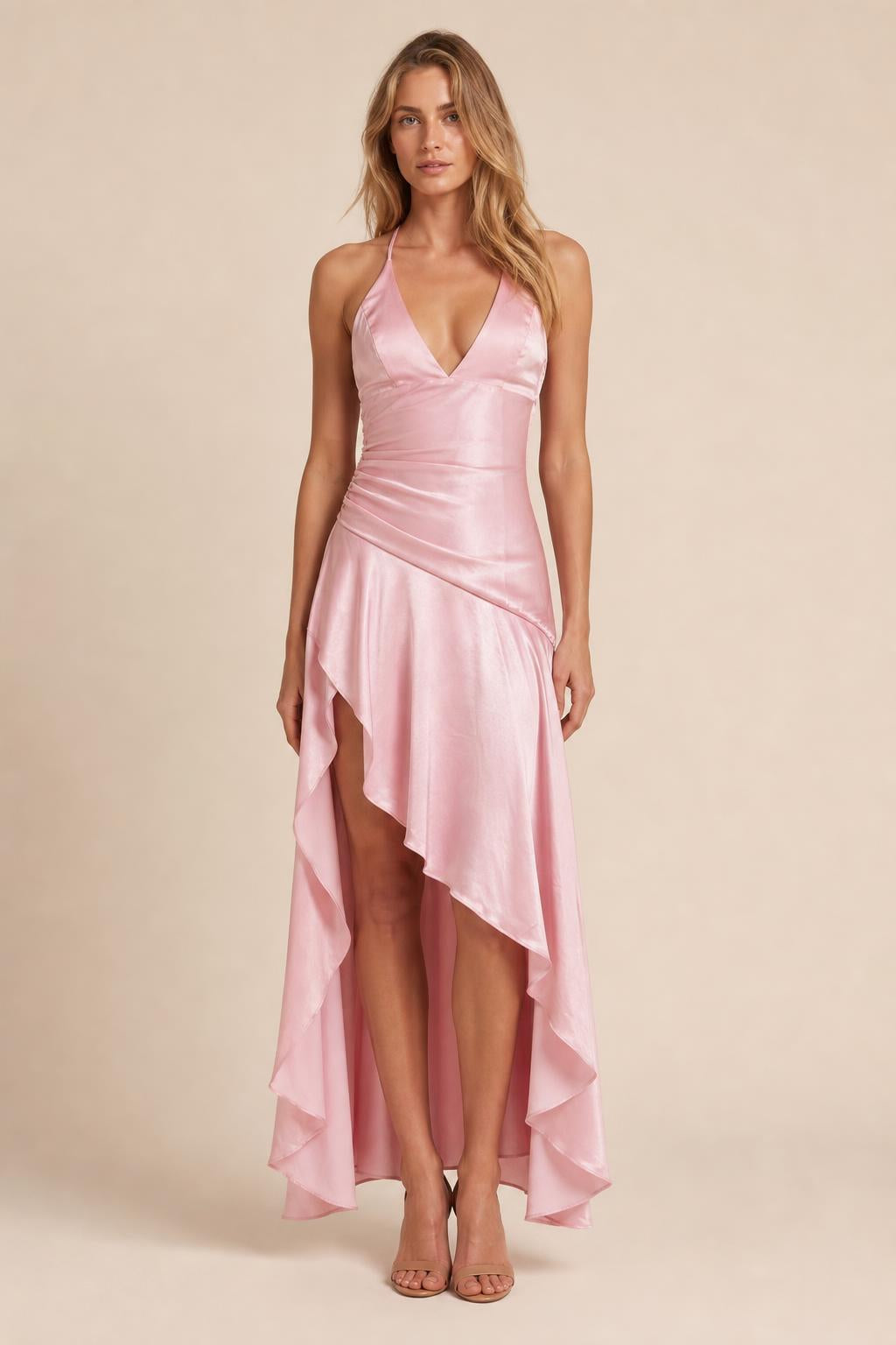 Model wearing pink satin halter high-low maxi dress from the front