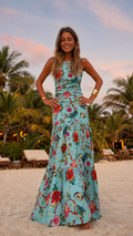 Front view of aqua floral sleeveless maxi dress with fitted bodice and tiered hem