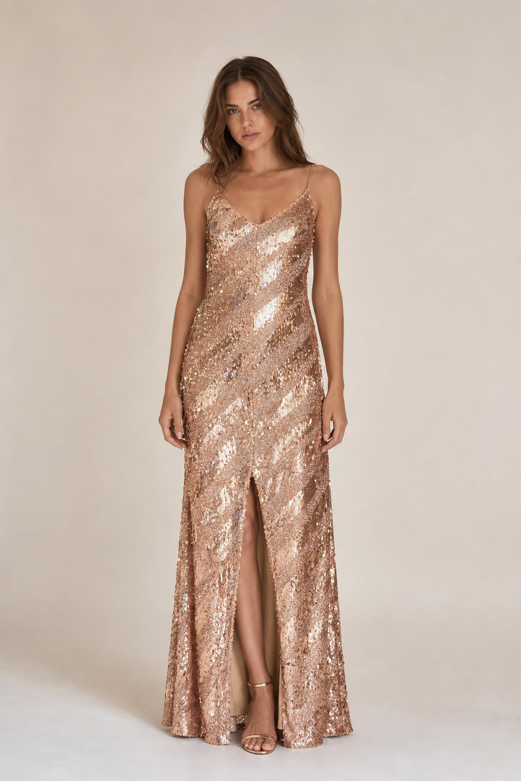 Model wearing Rose Gold sequined V-neck maxi dress from the front