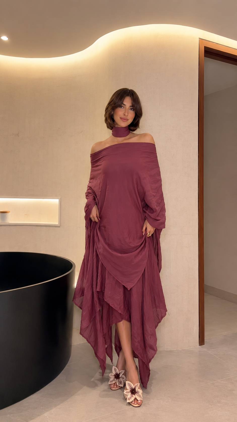 Front view of mauve off-shoulder draped maxi dress with matching choker neckline and handkerchief hem
