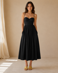 Black sweetheart neckline midi dress with spaghetti straps and gathered skirt front view