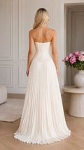 Back view of white strapless pleated long gown