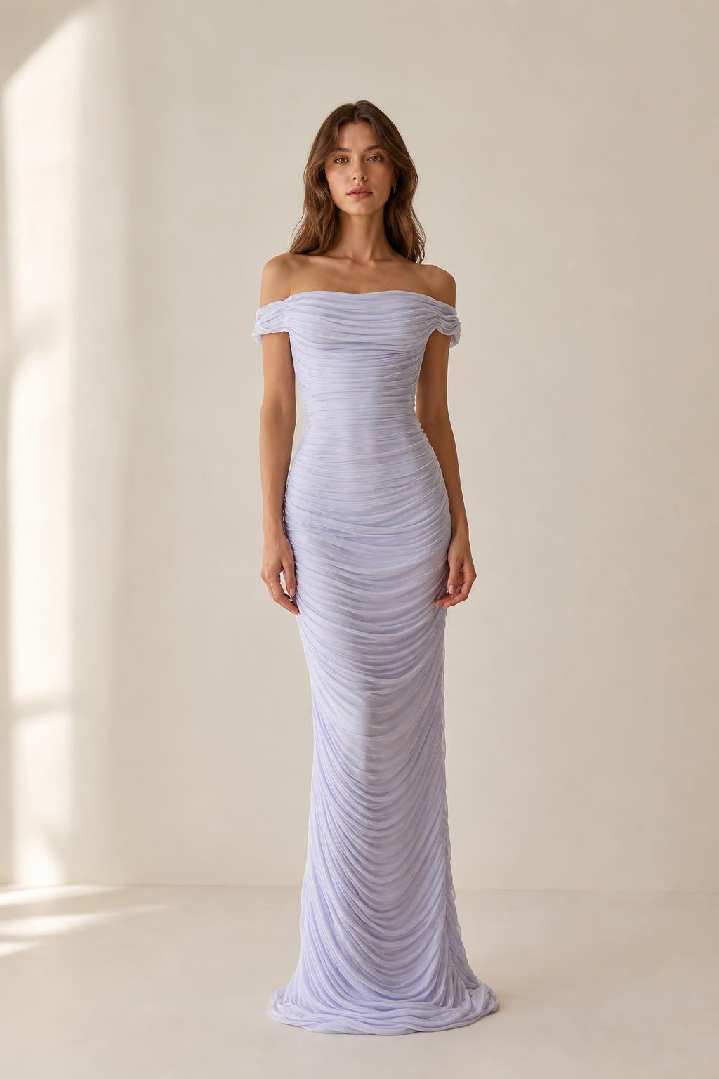 Front view of model wearing lavender off-the-shoulder ruched evening dress