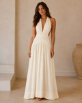 Ivory halter plunge maxi dress with ruched waist and flowing skirt front view