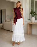 Burgundy satin-look sleeveless blouse with mock neck and side tie front view