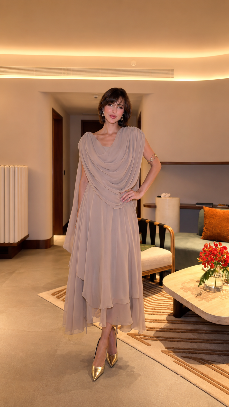 Front view of taupe draped chiffon-look midi evening dress with layered skirt