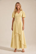 Front view of model wearing yellow V-neck flutter sleeve maxi dress