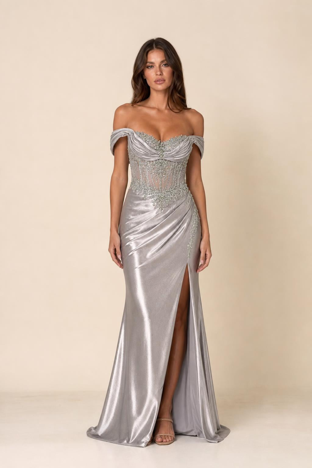 Front view of woman wearing silver off-shoulder beaded corset evening gown