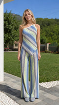 Front view of model wearing blue multi striped asymmetrical top and wide leg pants set