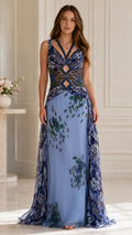 Front view of dusty blue embellished evening gown with sheer cutout bodice and floor-length skirt