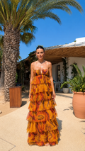Front view of strapless tiered ruffle maxi dress in amber abstract print