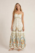 Front view of cream floral maxi dress on model