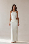 Front view of model wearing white cut-out ruched maxi dress
