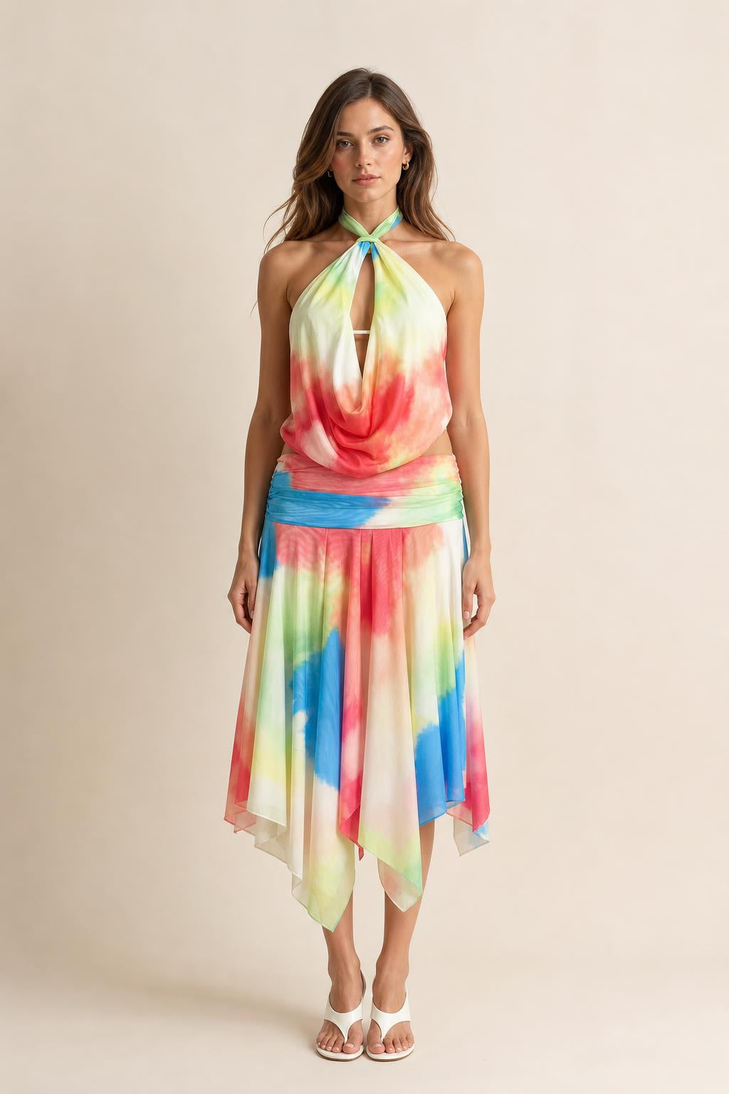 Front view of model wearing multi-color tie-dye halter neck midi dress