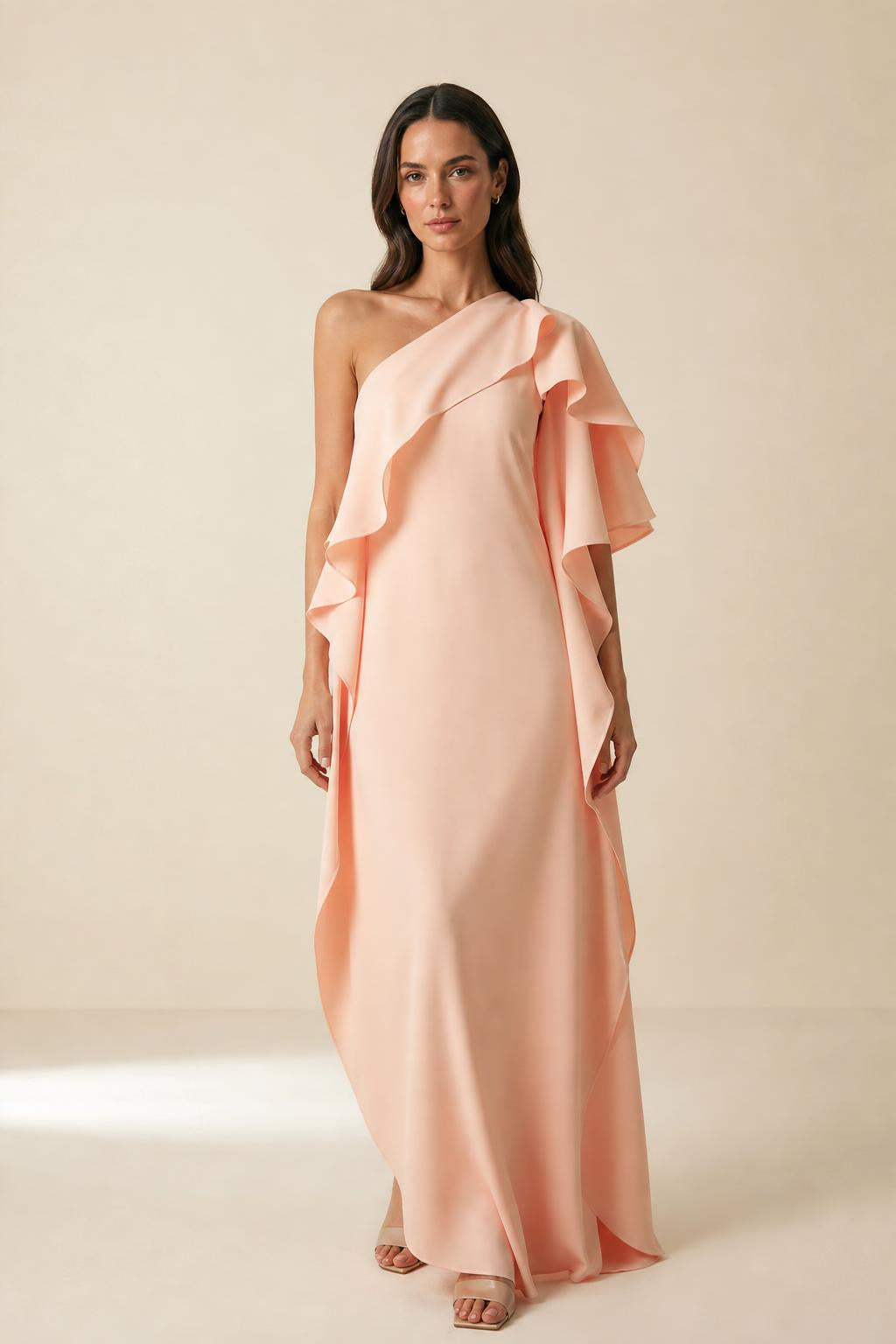 Front view of model wearing peach one-shoulder ruffle maxi dress
