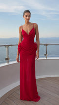 Front view of red cowl neck maxi dress with floral hip detail