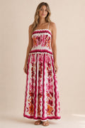 Front view of floral print smocked maxi dress in white