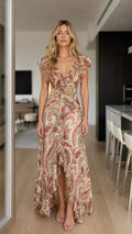 Front view of model wearing beige boho paisley maxi dress