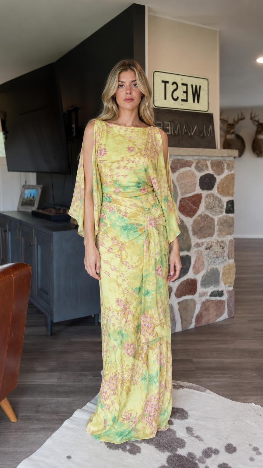 Front view of model wearing Yellow floral chiffon maxi dress with cape sleeves