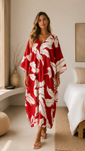 Front view of red tropical print V-neck caftan maxi dress with flowing silhouette