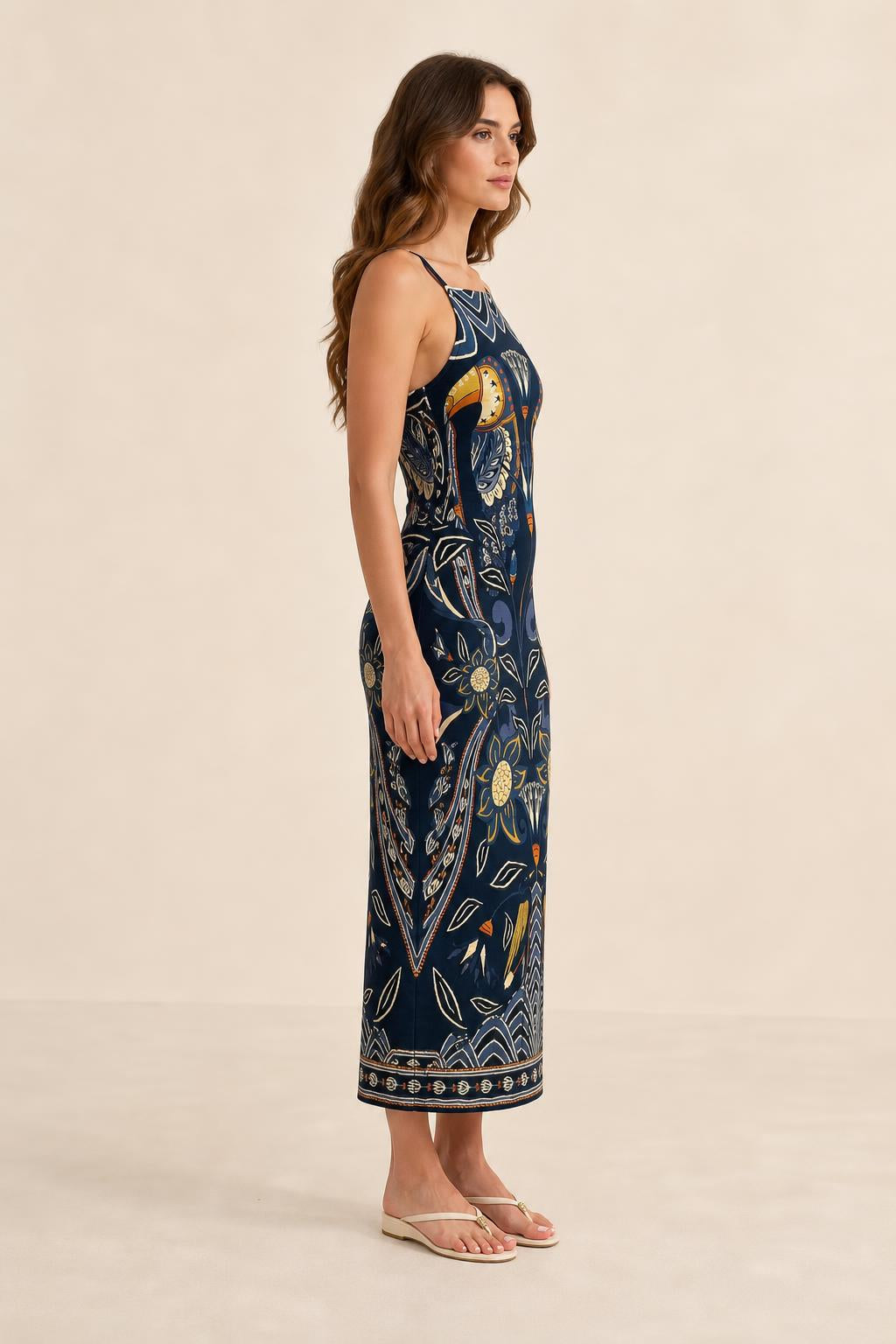Side profile view of model in Navy printed midi dress