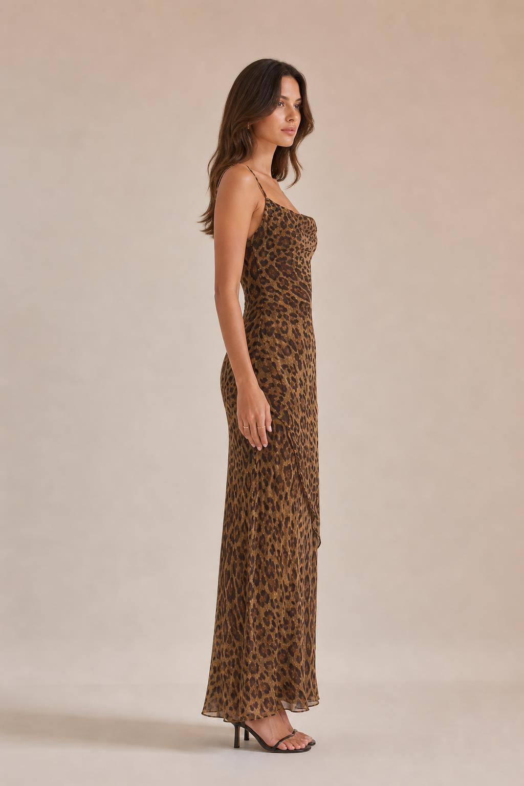 Side view of woman in brown leopard print maxi slip dress