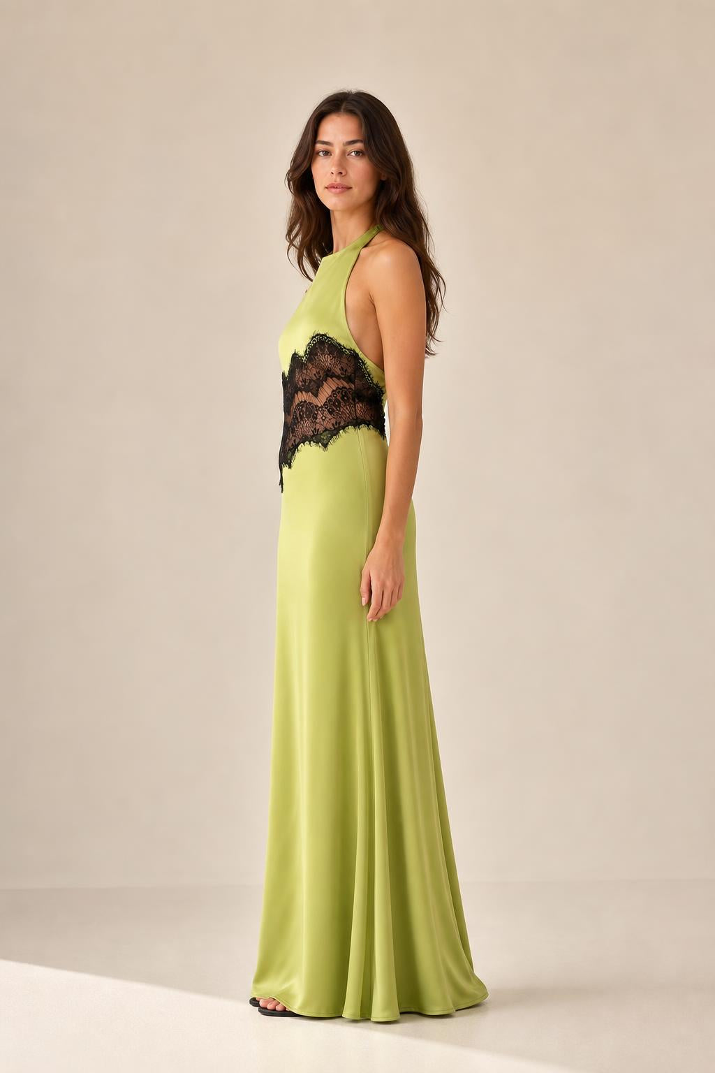 Side profile view of chartreuse halter maxi dress