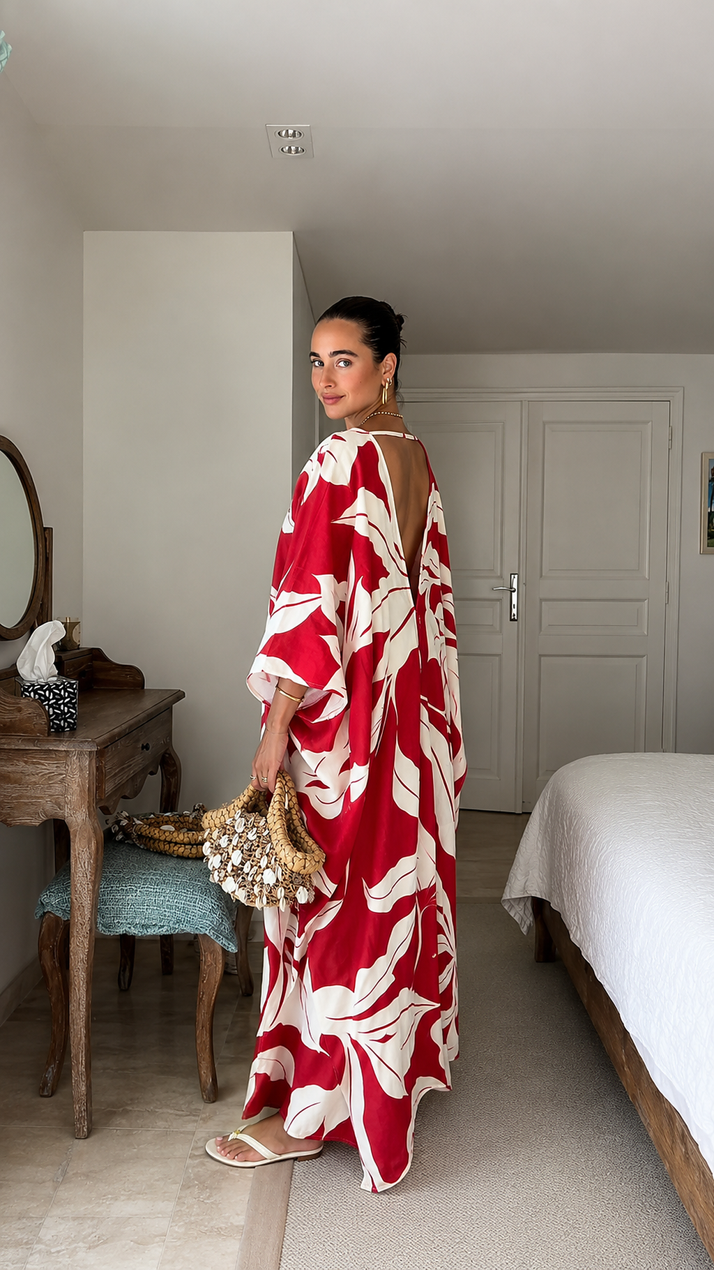 Side view of red tropical print caftan maxi dress showing open back detail