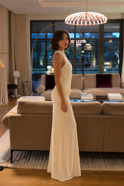 Side profile view of Champagne draped maxi dress