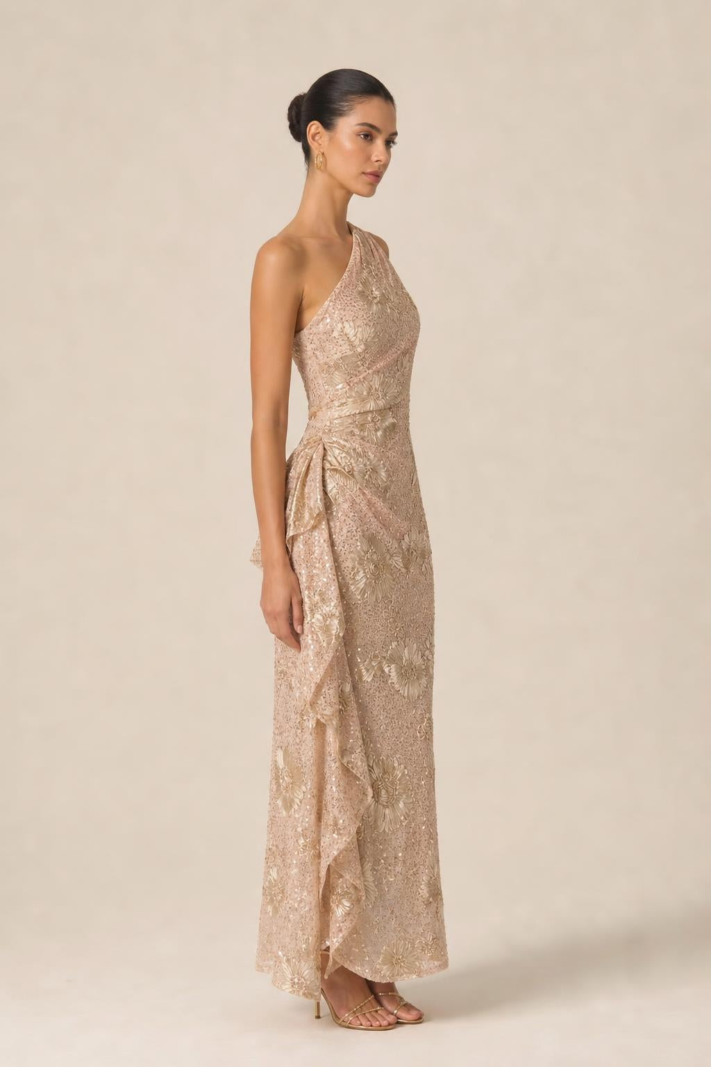 Side profile of champagne one-shoulder evening gown