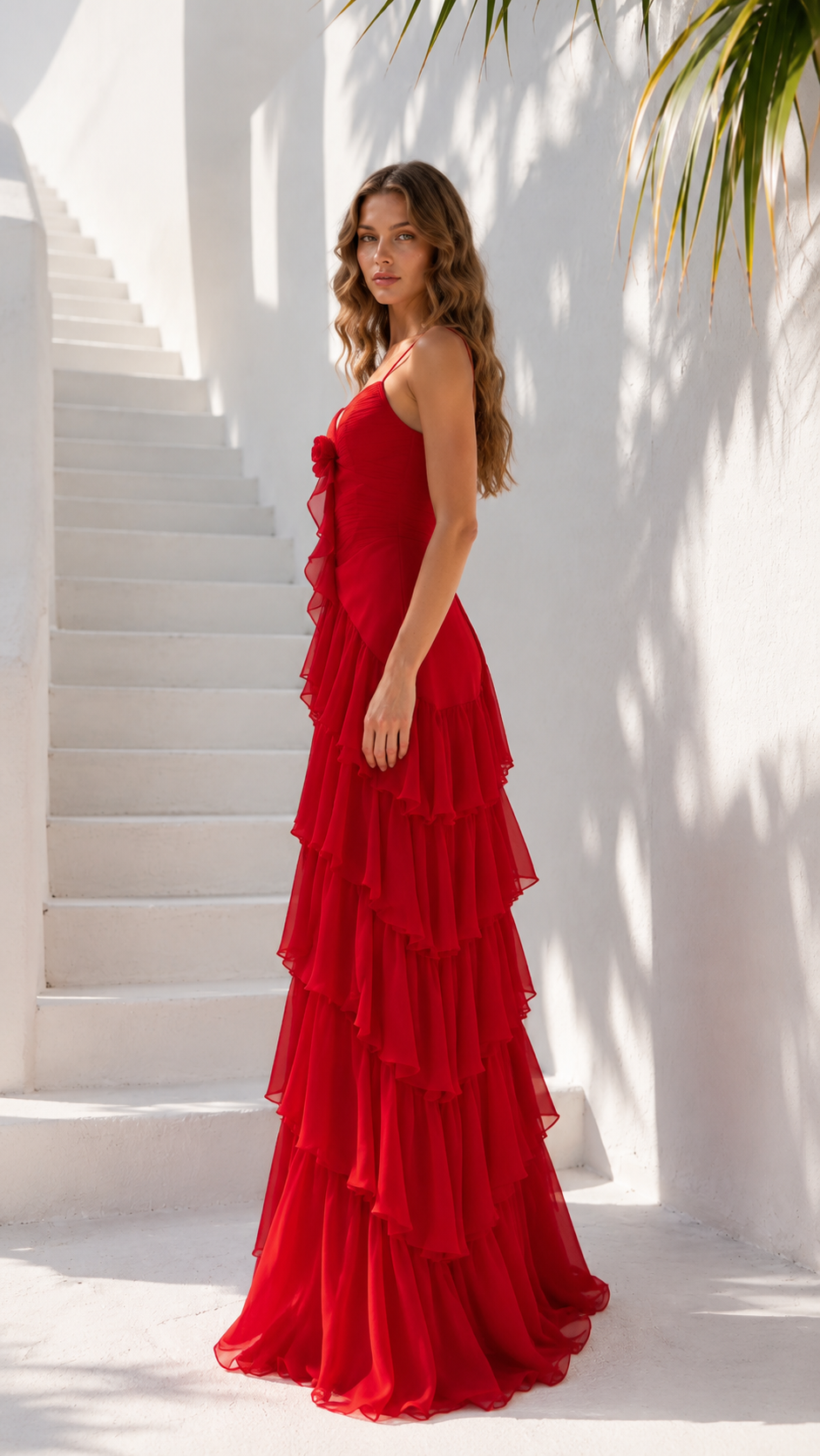 Side view of red layered chiffon-look maxi dress with cascading ruffles