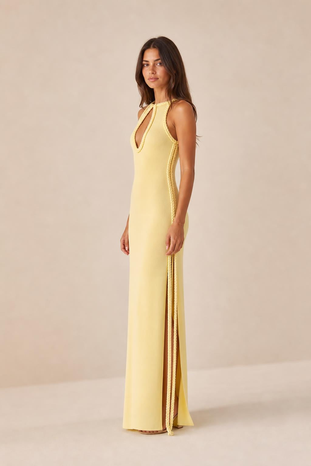 Side view of model wearing yellow maxi dress