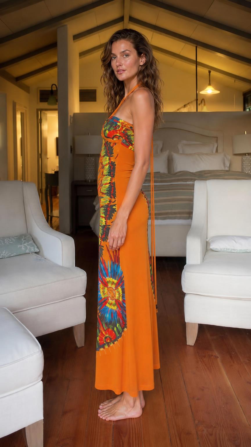 Side profile view of orange halter maxi dress