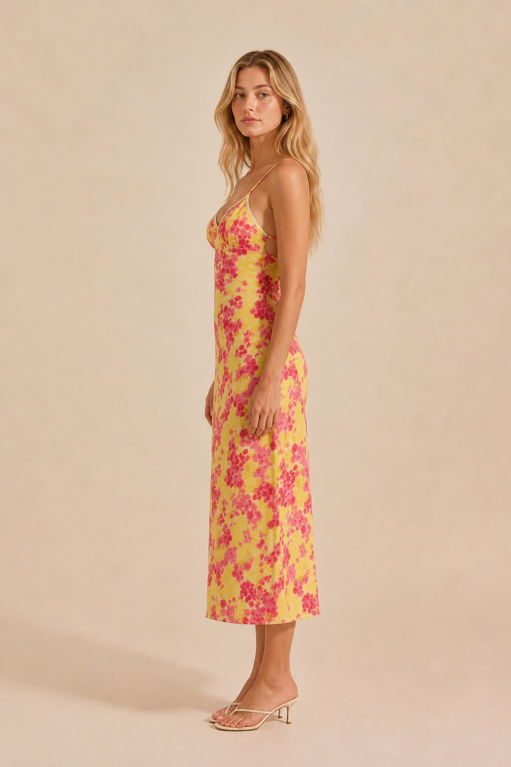 Side view of yellow floral midi slip dress