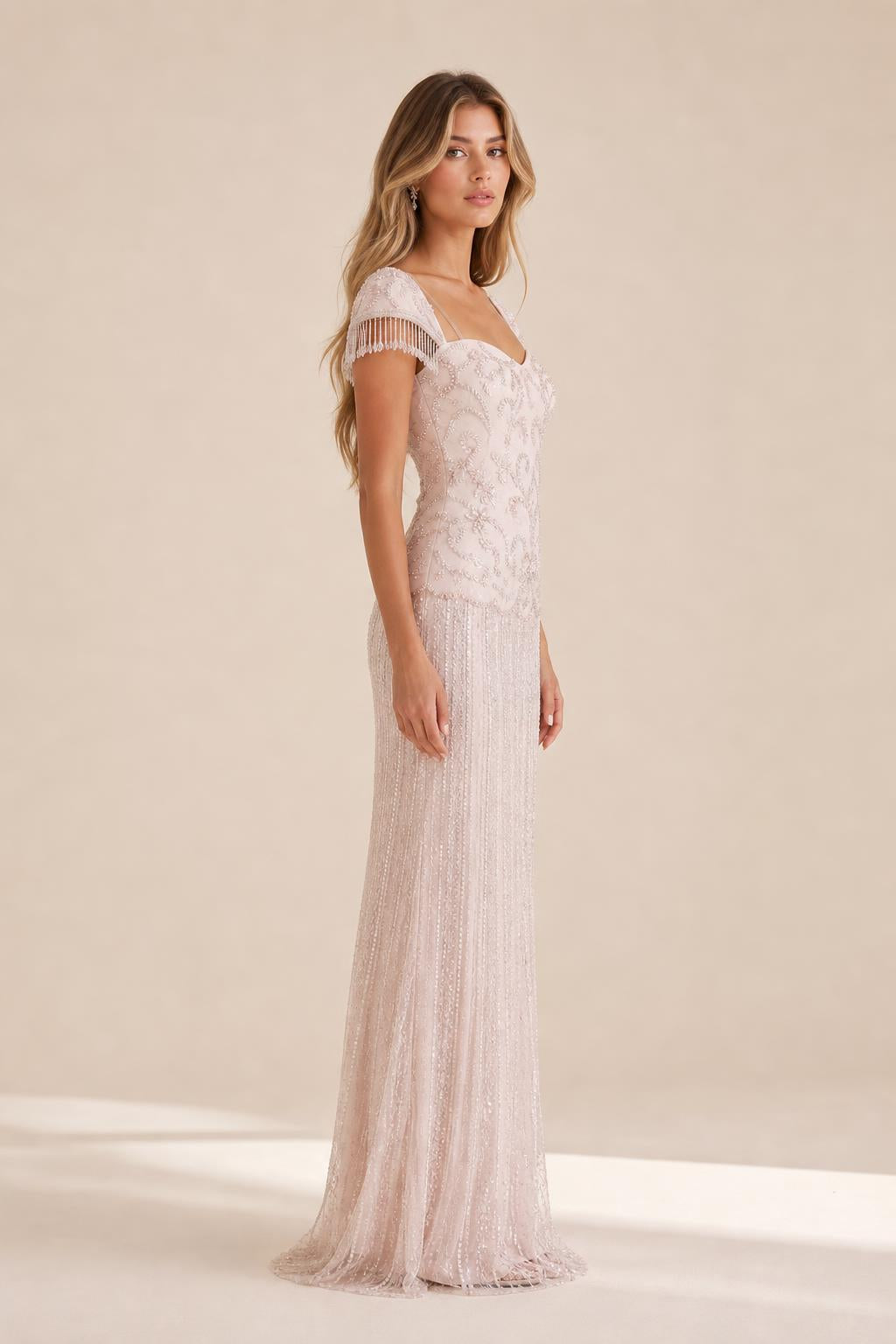 Side profile view of the blush evening gown