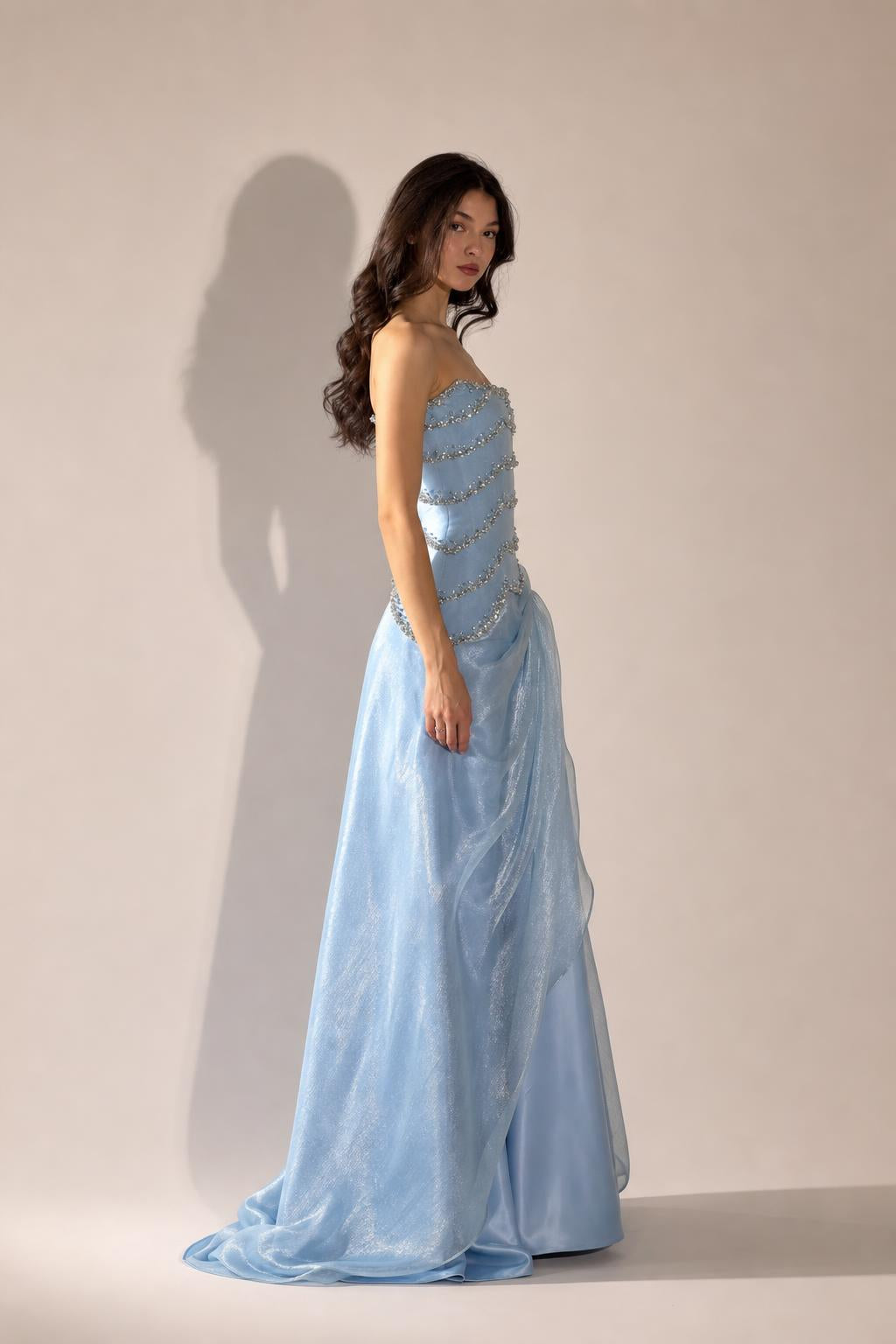 Side profile view of Light Blue formal gown