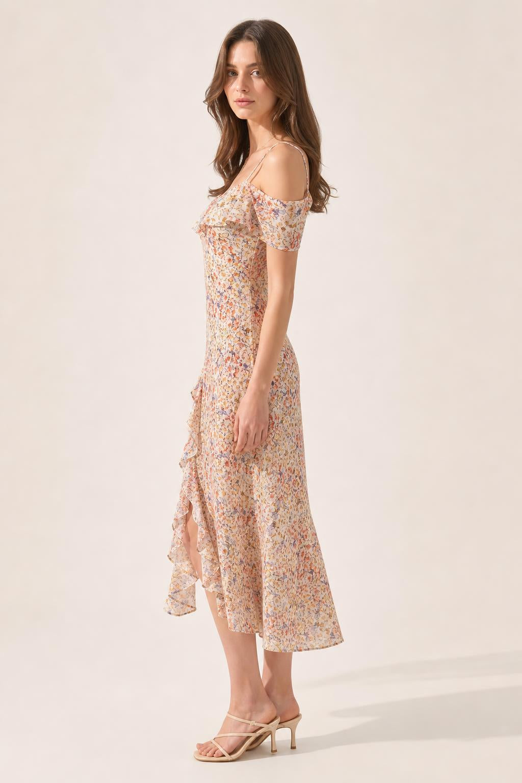Side profile view of beige floral midi dress