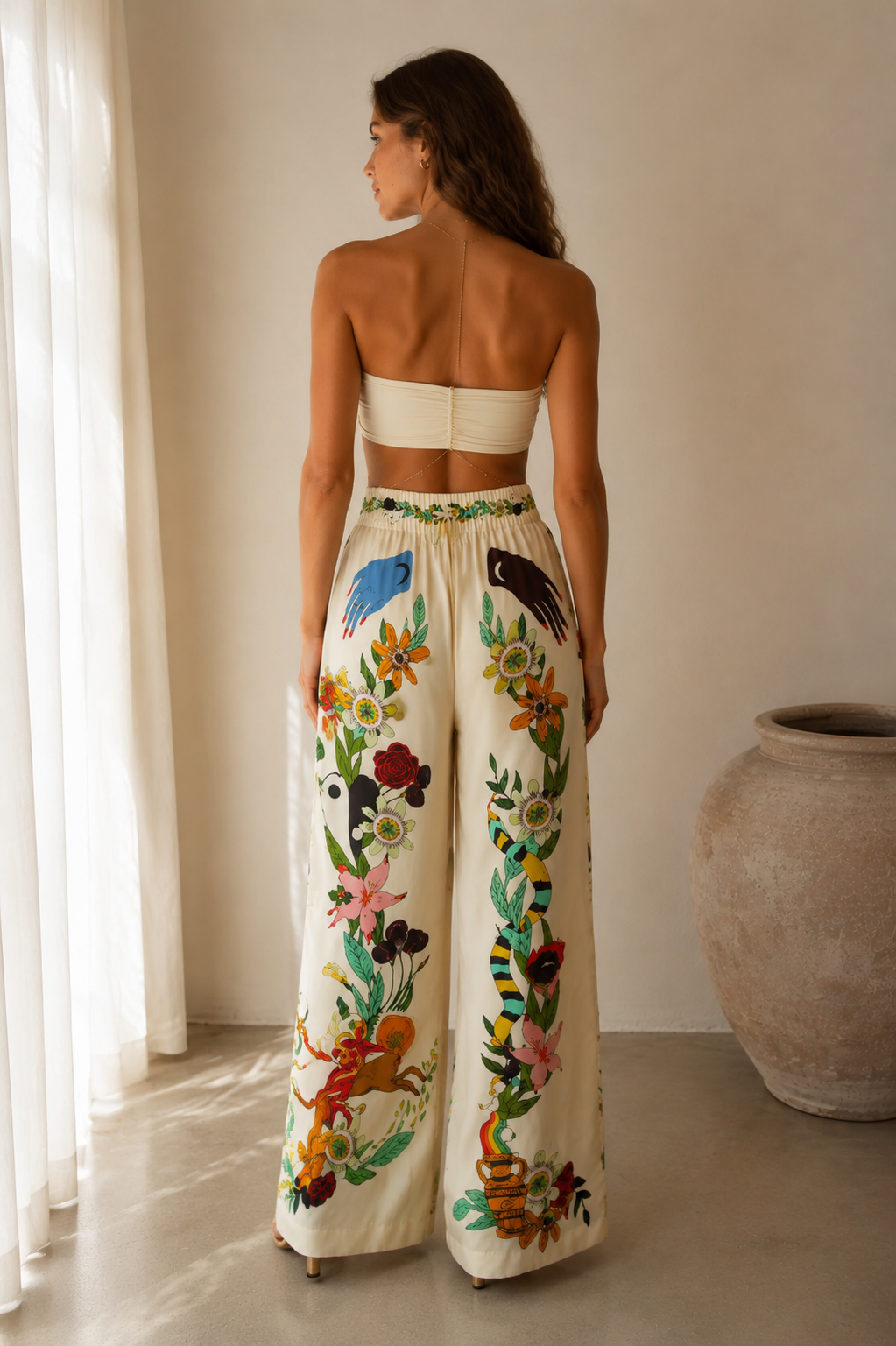 Back view of ivory bandeau top and floral printed wide-leg pants set