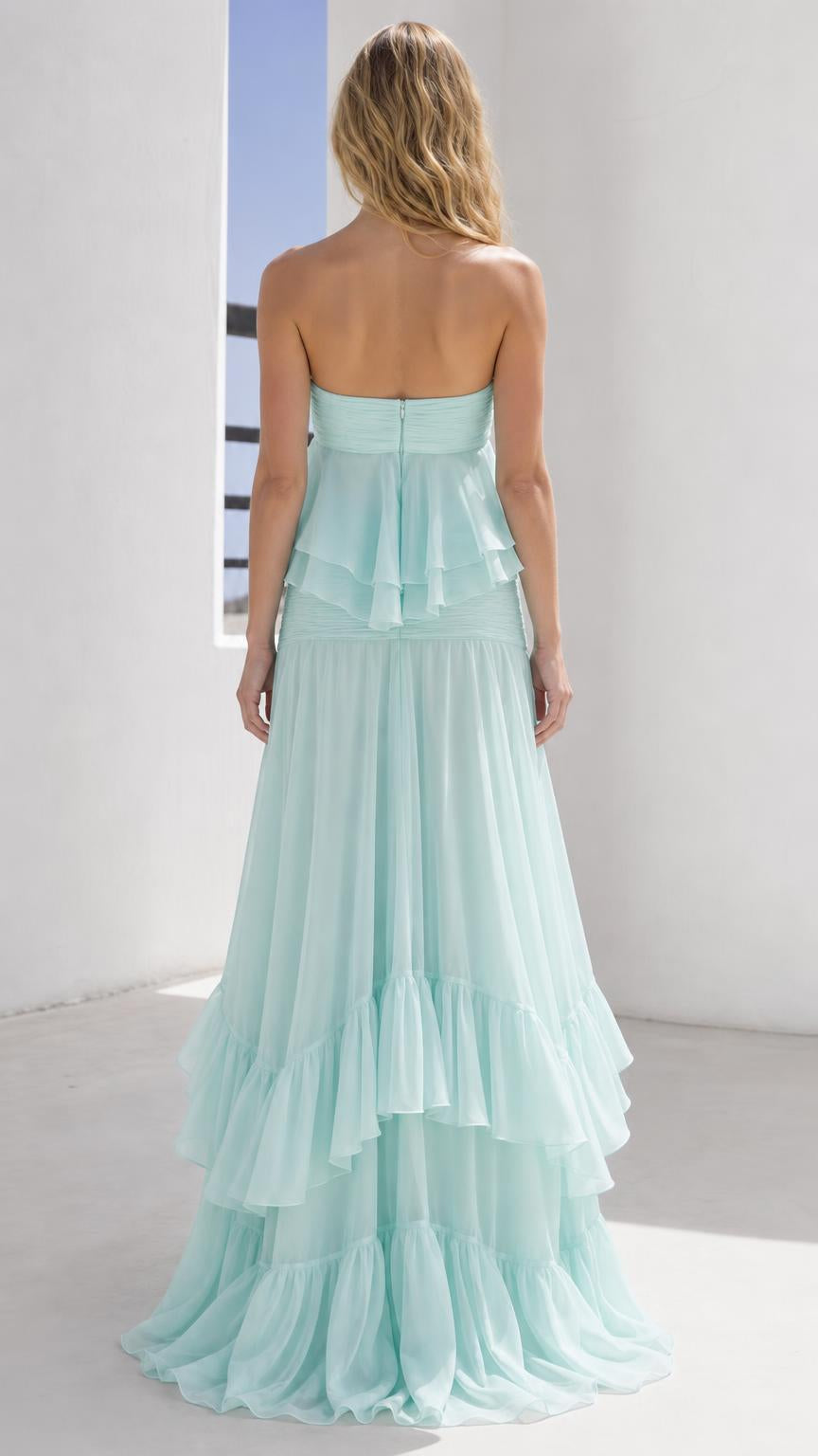 Back view of model wearing mint green strapless ruffled maxi dress