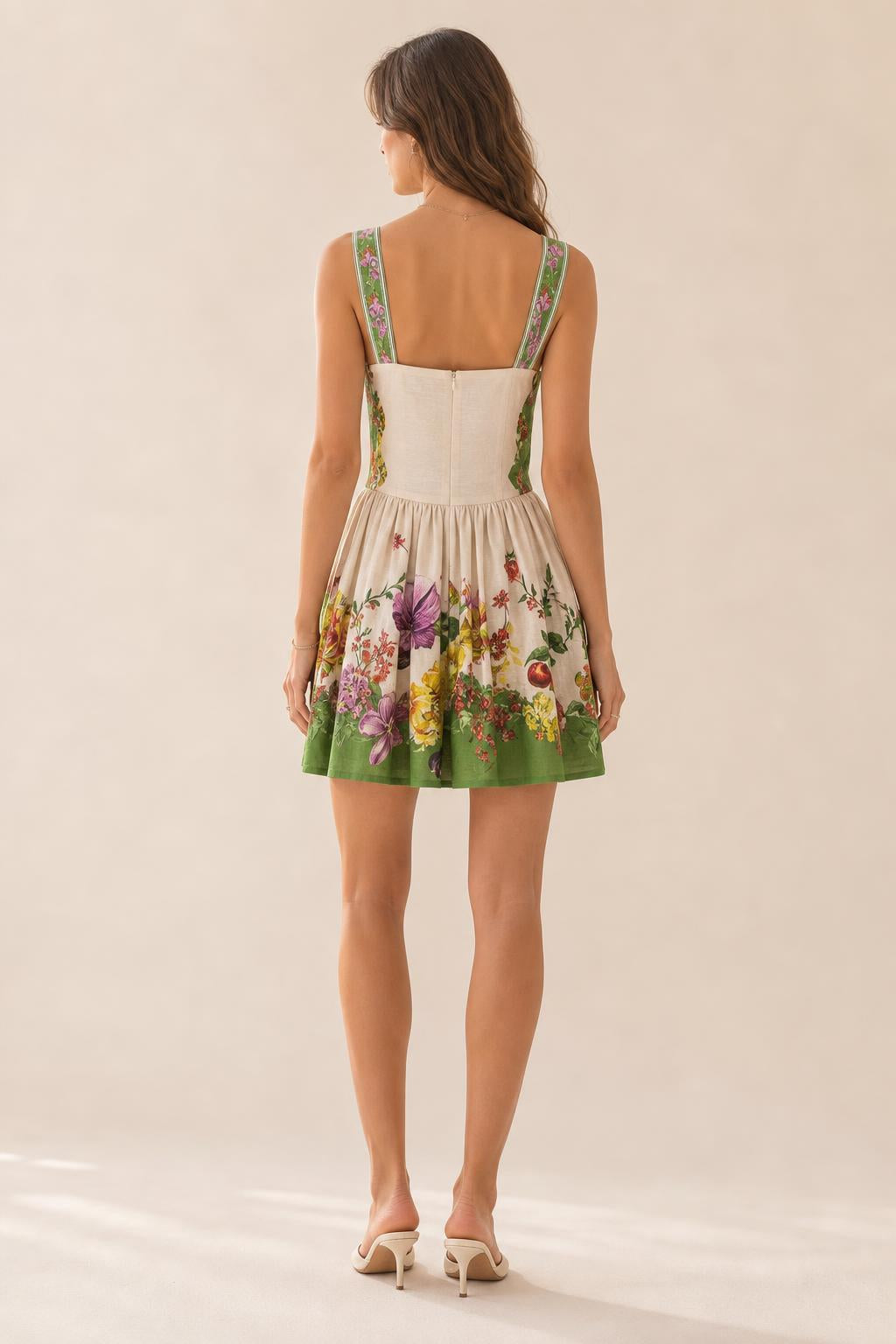 Back view of model showing back zipper and strap details