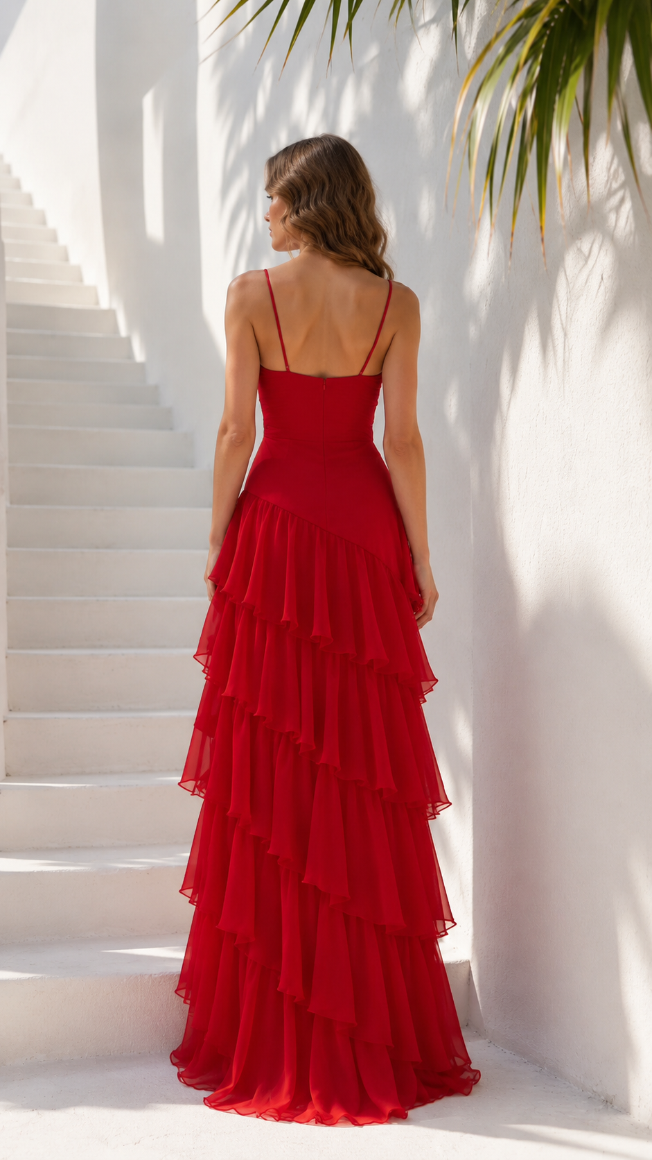 Back view of red spaghetti strap maxi dress with tiered skirt