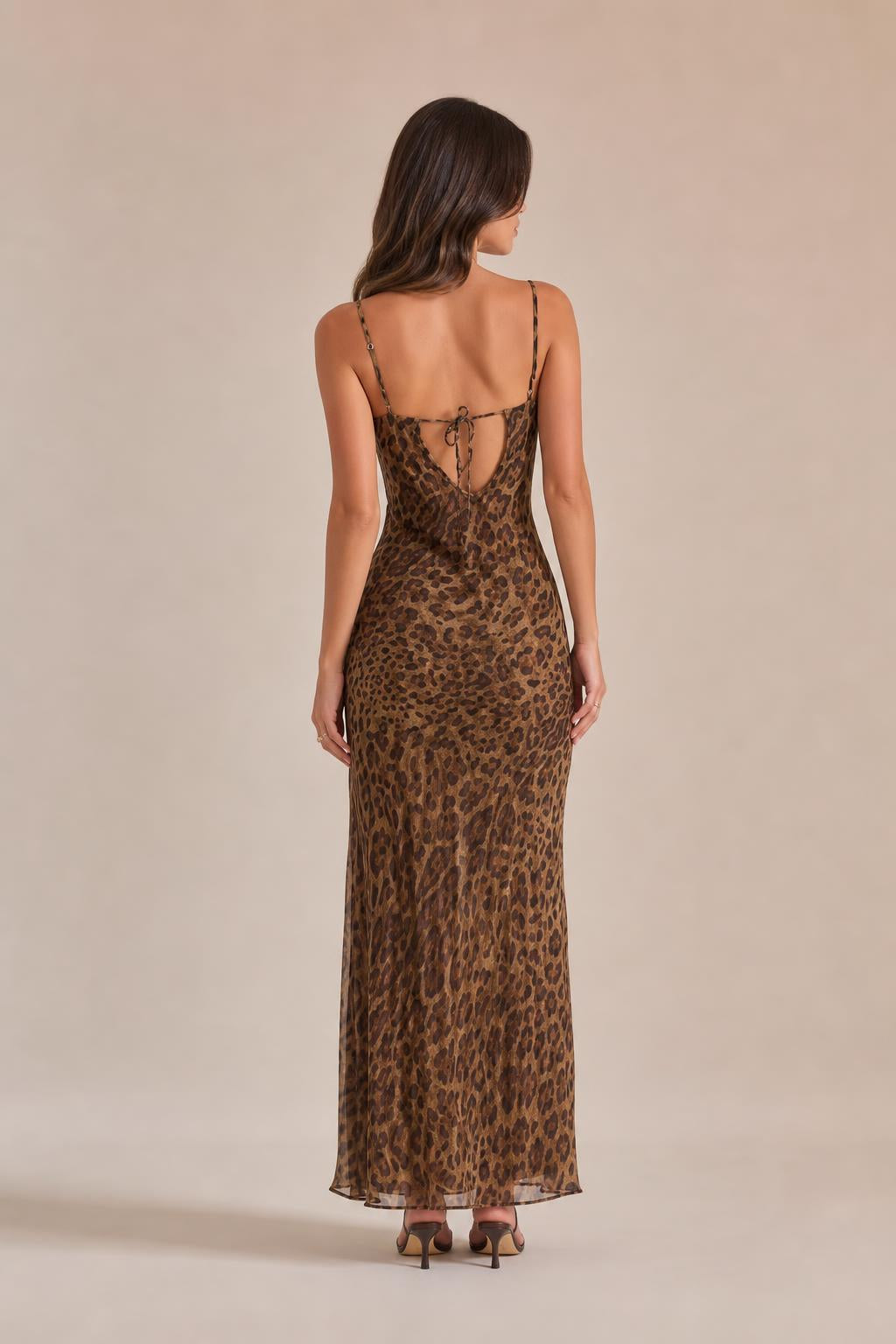 Back view showing adjustable tie straps on brown leopard print maxi dress