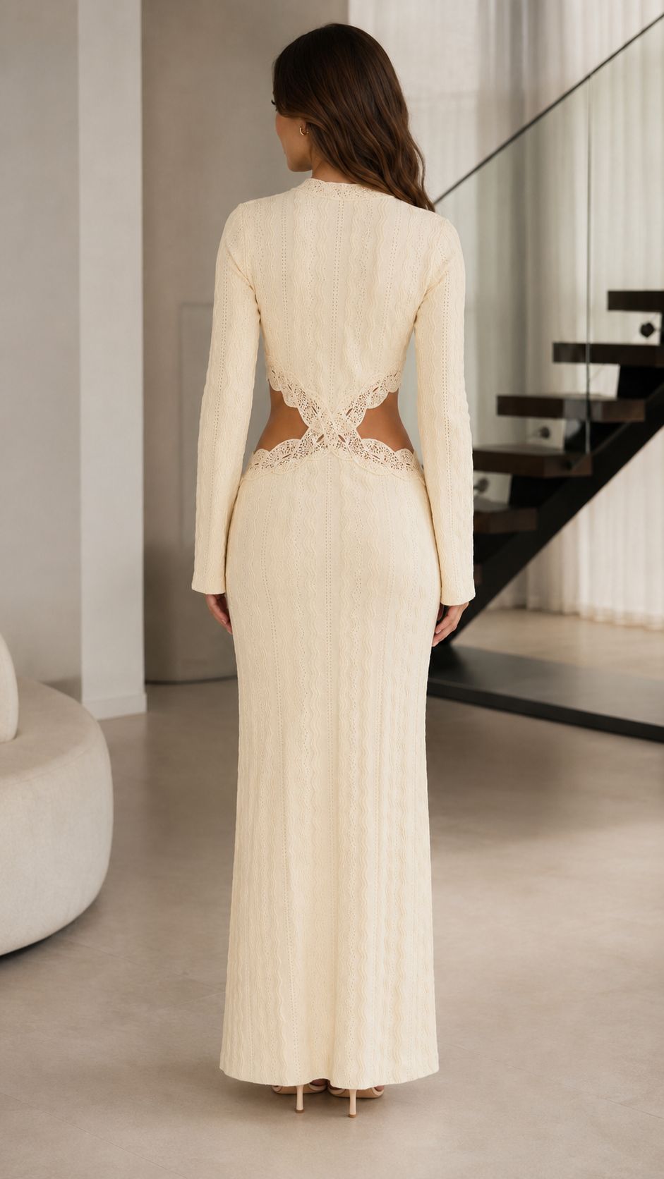 Back view of cream textured maxi dress with lace-trim open waist design