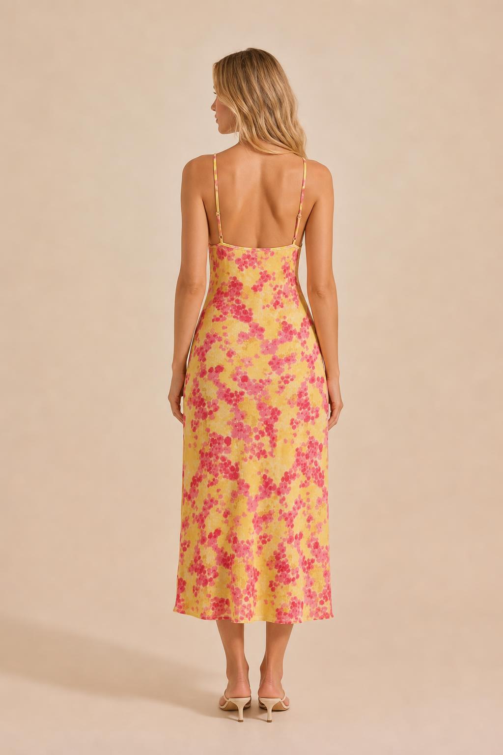 Back view of yellow floral midi slip dress