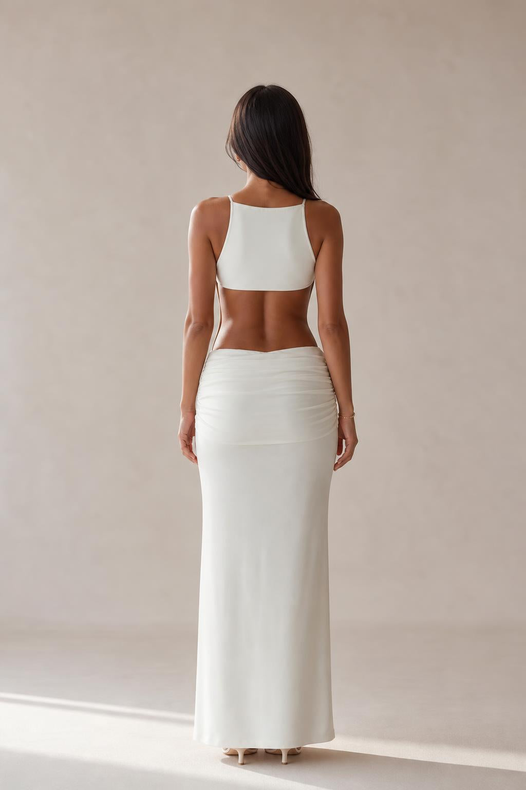 Back view of white cut-out maxi dress