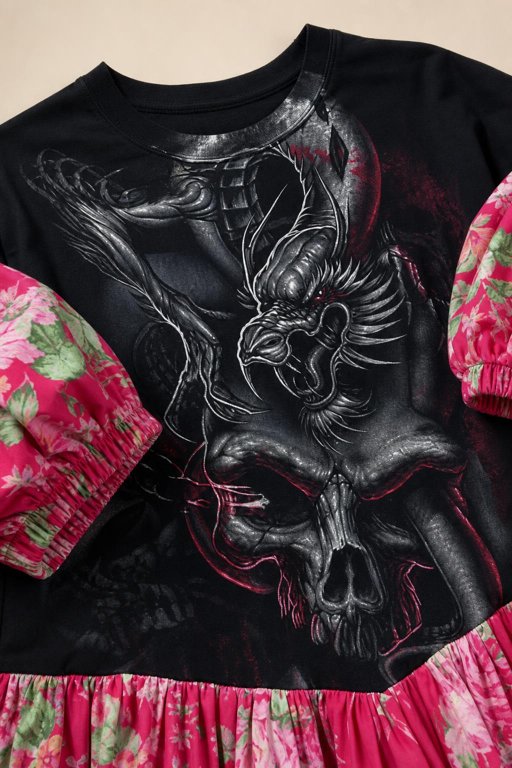 Close-up of dragon and skull graphic chest print