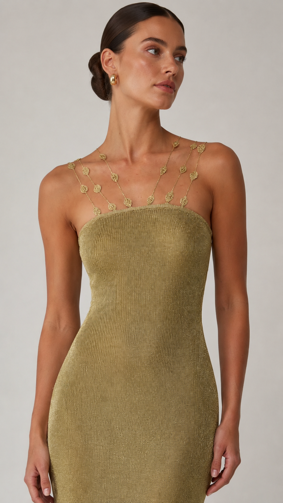 Close-up of olive textured maxi dress with delicate beaded neckline straps