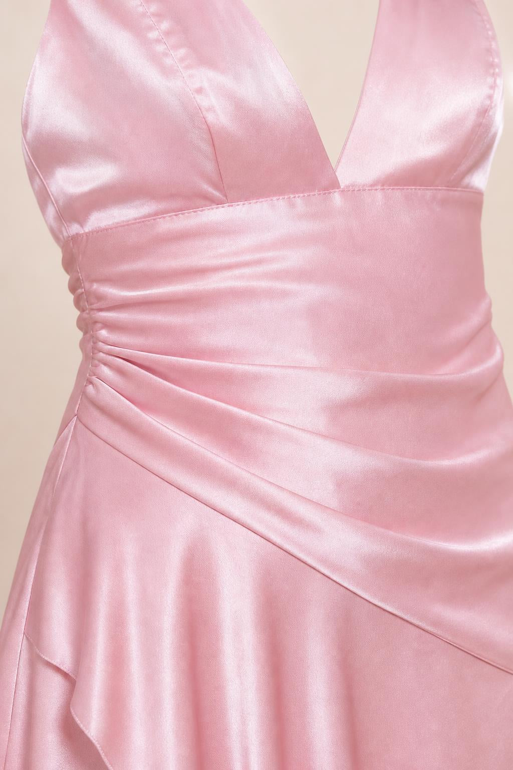 Close-up of side ruching and bodice detail on pink satin dress