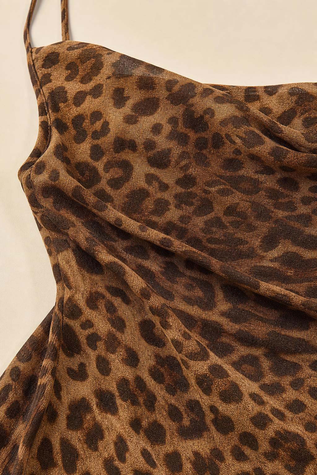 Close-up texture view of brown leopard print fabric and cowl neckline